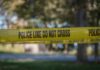 Two Down, Two Cuffed – What Really Happened? yellow police tape cordoning off an outdoor area