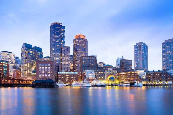 shutterstock_1029115462 City skyline with illuminated waterfront at dusk
