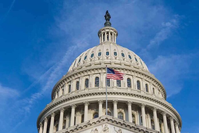 shutterstock_1108348019 United States Capitol dome with American flag