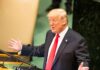 Trump’s Timing Lights Up 9/11 speaker in suit gestures at podium