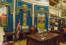Oval Office-style desk and decor in a museum display