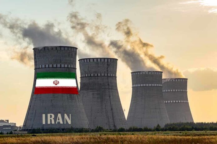 shutterstock_1590729430-2 nuclear power plant cooling towers in Iran at sunset