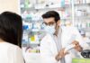 Millions Skipped the Doctor. Now It’s Expanding Pharmacist wearing mask explains medication to customer