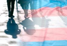 Behind the Numbers Nobody Should Ignore trans pride flag overlaying silhouettes of people walking on a city street