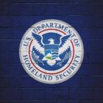 Florida Detention Scandal Sparks Outrage U.S. Department of Homeland Security seal on a blue brick wall