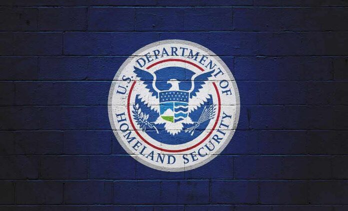 U.S. Department of Homeland Security seal on a blue brick wall