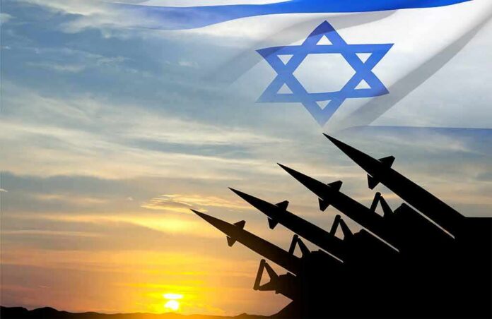 Israeli flag over missile silhouettes at sunset