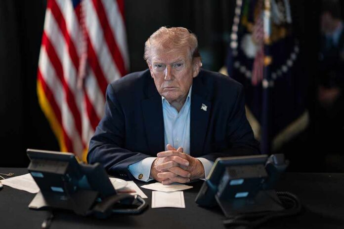 President,Donald,J.,Trump,Oversees,Operation,Epic,Fury,At,Mar-a-lago, Donald Trump seated at a table between two desk phones