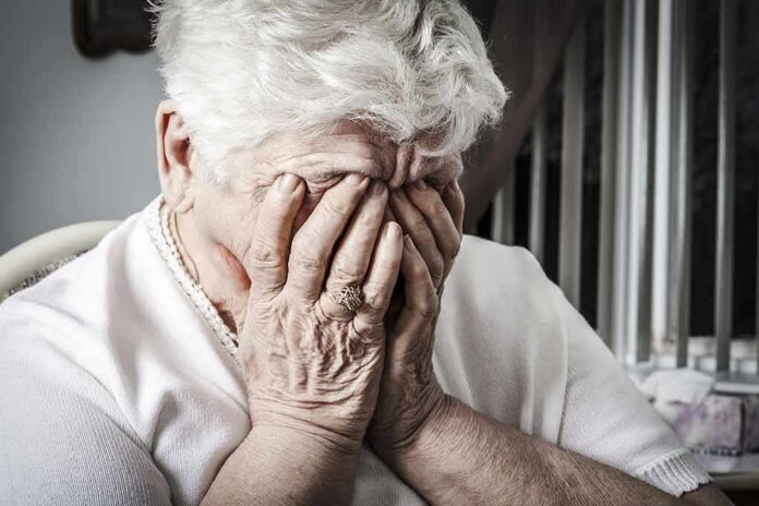 shutterstock_283988126 Elderly woman covering her face with her hands