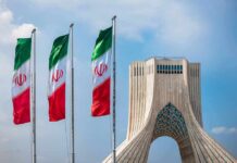 Iranian flags beside Azadi Tower in Tehran