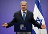 Trump-Iran Card: Netanyahu’s Big Bet man in suit speaking at a podium with Israeli flag