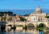 St. Peter's Basilica behind Ponte Sant'Angelo over the Tiber River