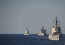 A Rebel Leader Draws Another Line at Sea Three naval warships sailing in formation on open sea