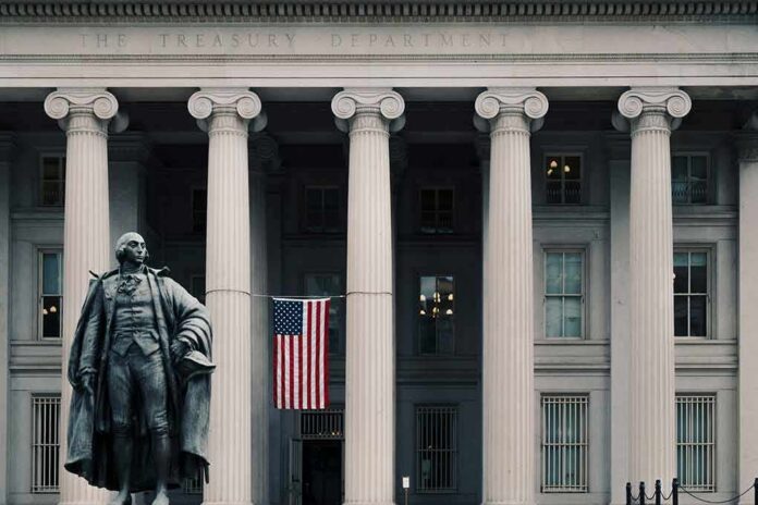 Statue in front of a neoclassical government building with columns and a U.S. flag