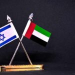 Post-Election Window Turns Volatile Israeli and UAE flags on crossed desk stand