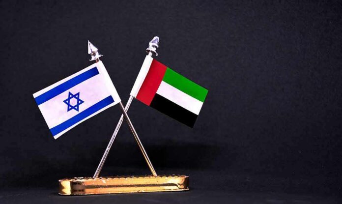 Israeli and UAE flags on crossed desk stand