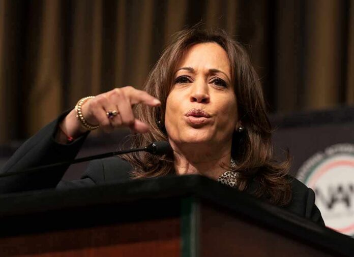 Woman speaking at a podium and gesturing with her hand