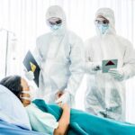 Imported Ebola Case Alarms Nigeria Medical staff in hazmat suits attend to a patient in a hospital bed