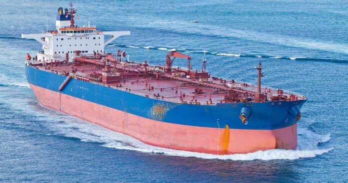 Large cargo ship navigating through the ocean