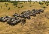 Airborne Infiltrations Rehearsed – Days Before Vote Rows of military tanks with soldiers assembled on a dry field