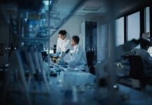 Scientists working in a dim laboratory