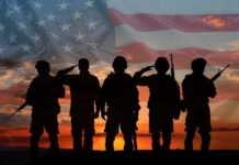 Soldiers saluting at sunset with American flag overlay
