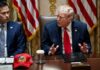 Donald Trump speaks at a meeting table beside Marco Rubio