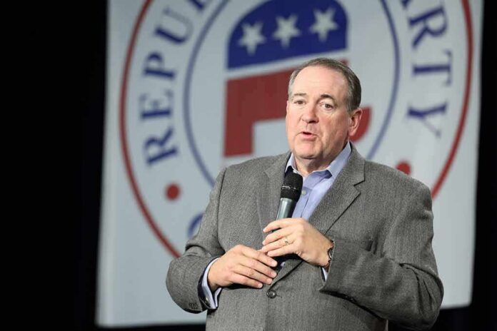 shutterstock_345617885-1 Mike Huckabee speaking on stage with a microphone