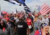 Stadium Chaos Looms: Trump Crashes Bama – Georgia Dennis Erickson, Carlos Hyde, and Danny Hope among a crowd at a patriotic rally