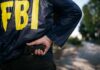 FBI Nabs Teen Before Alleged Hit FBI agent in jacket drawing a handgun