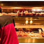 Cringe Clip Drowns Policy, Ignites Mockery Worker stocking fried food display case